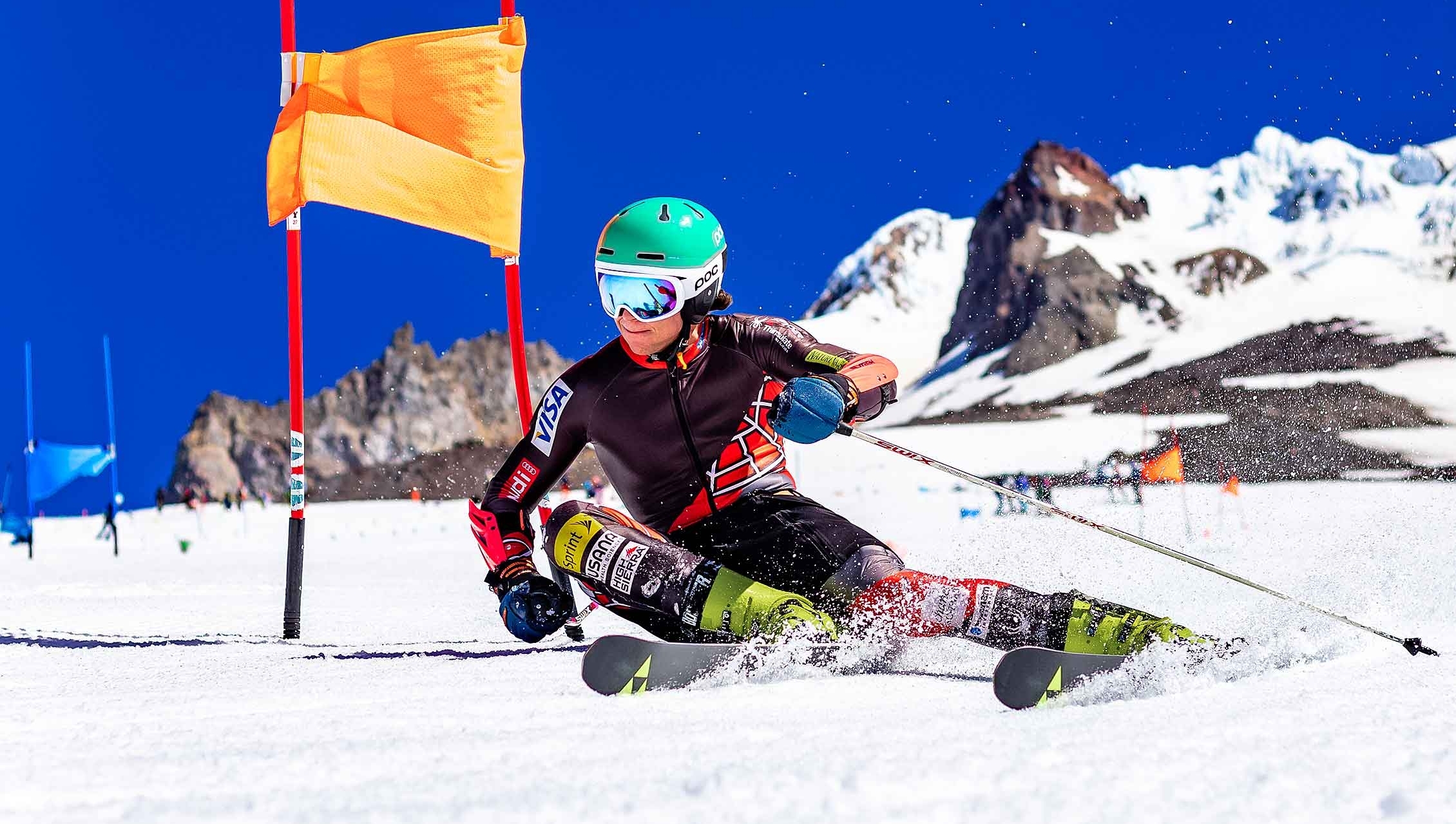 SKI RACER ROUNDING A FLAG ON PALMER AT TIMBERLINE
