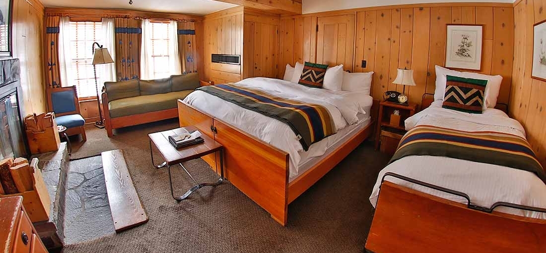 TIMBERLINE KING FIREPLACE HOTEL ROOM WITH A TWIN BED AND SEATING AREA