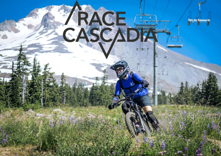 MOUNTAIN BIKER RIDING IN FRONT OF MT. HOOD WITH RACE CASCADIA LOGO ABOVE