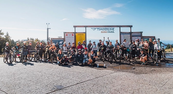 Group picture from Ladies Ride Day 2024 in front of the Timberline Bike Park entrance