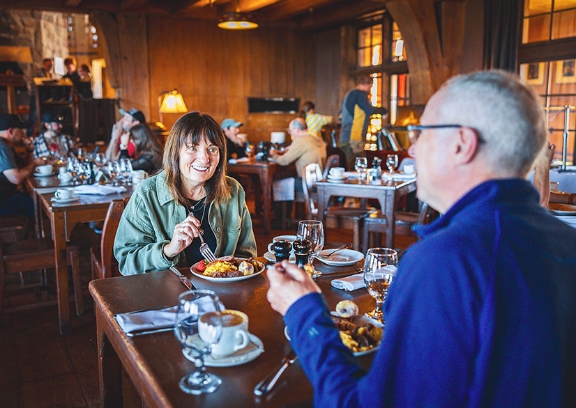 Couple enjoying the breakfast buffet at Timberline's Cascade Dining Room