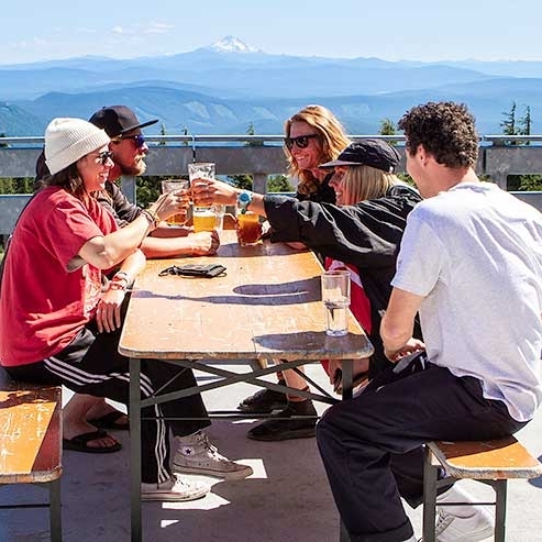 FRIENDS CHEERSING ON THE Y'BAR DECK