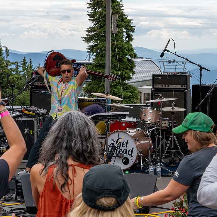 TONY SMILEY PLAYING THE GUITAR BEHIND HIS HEAD AT TIMBERLINE DAYDREAM