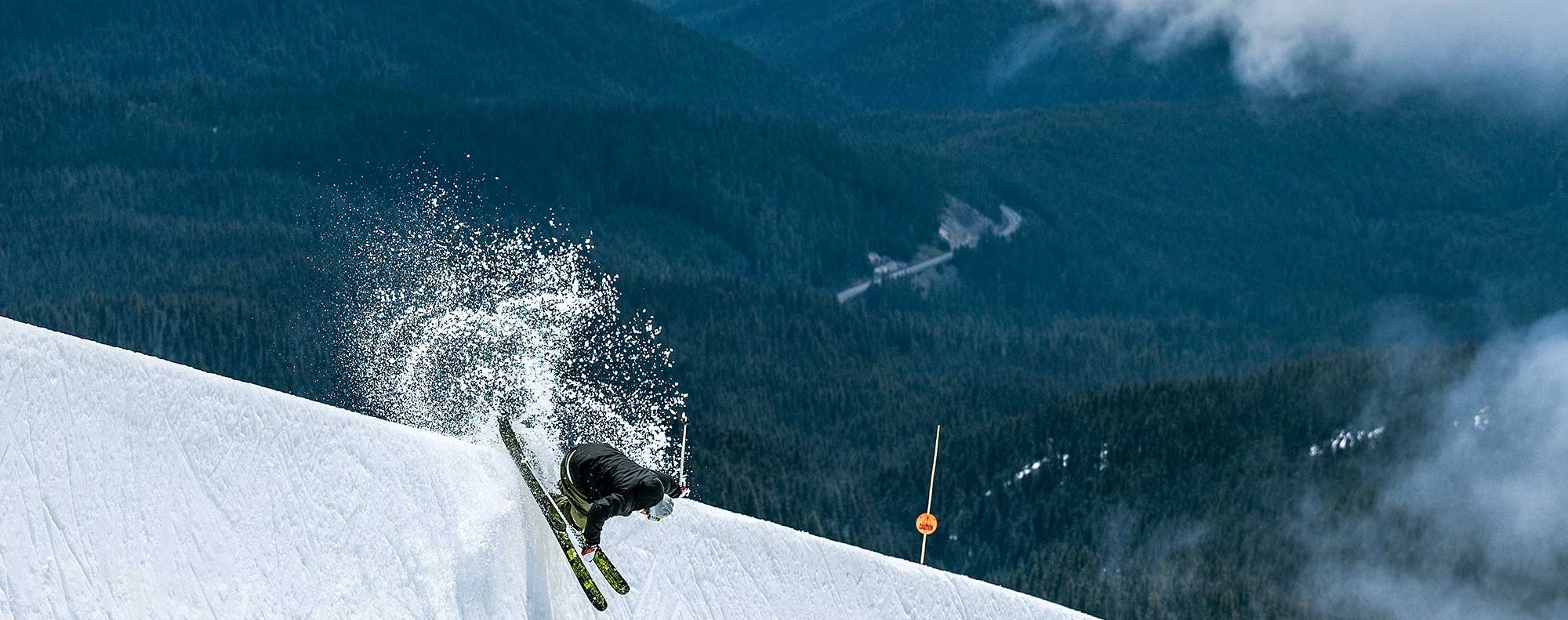 Skier hitting the halfpipe at Timberline in early June