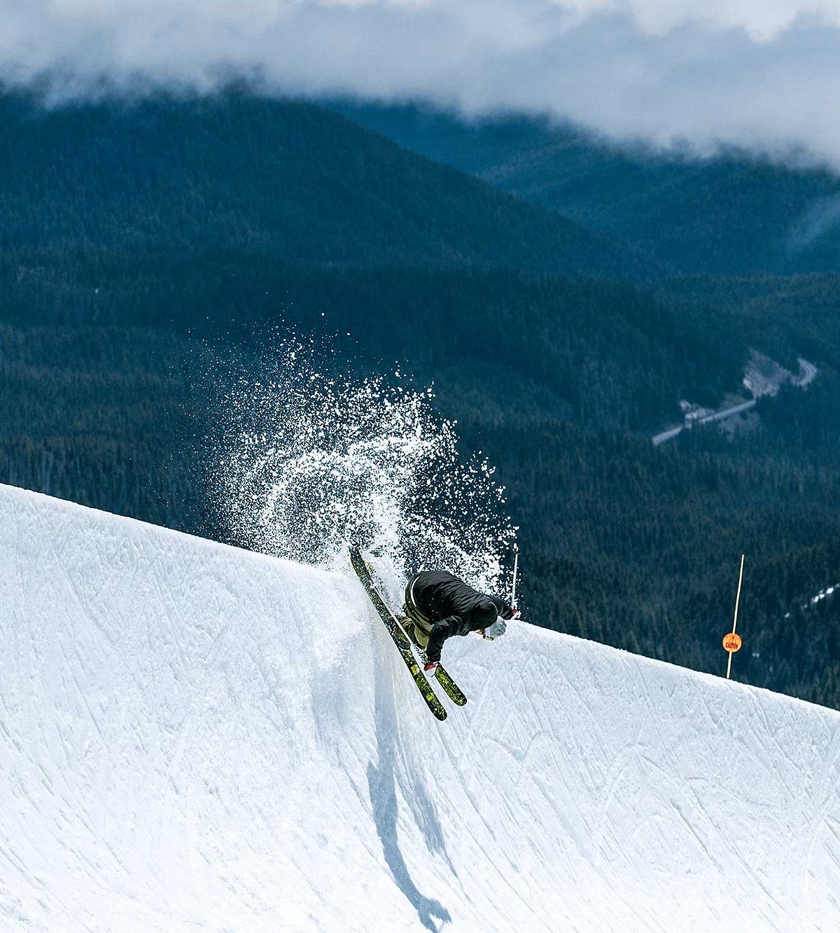 Skier hitting the halfpipe at Timberline in early June
