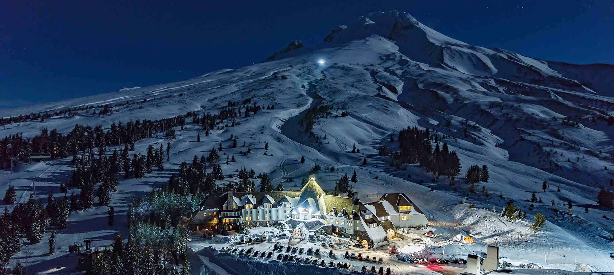NIGHT-TIME DRONE VIEW OF TIMBERLINE LODGE AND MT. HOOD