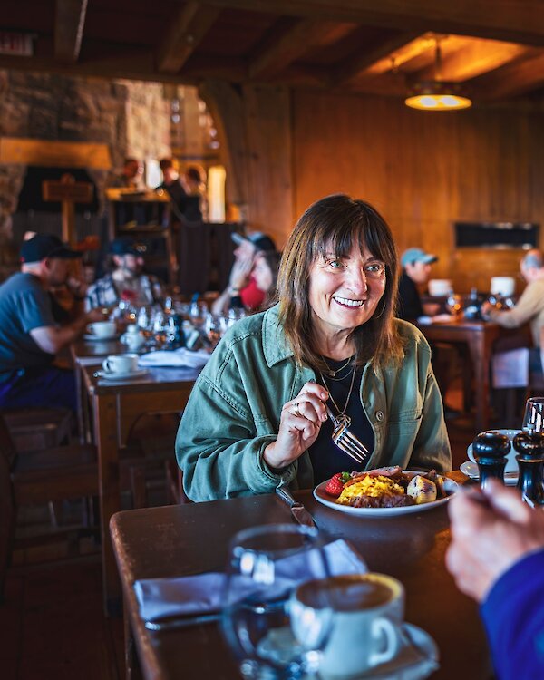 Couple dining at the Cascade Dining Room breakfast buffet at Timberline